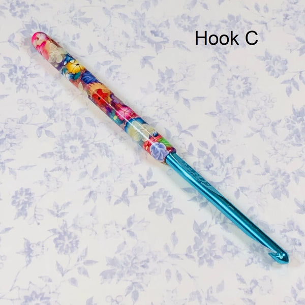 Susan Bates H/8 Polymer Clay Covered Crochet Hook - Multicolored Flowers and Translucent Butterflies