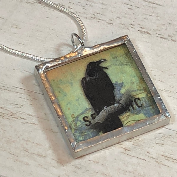 Handmade Double-Sided Glass and Silver Soldered Charm Pendant Necklace - 1"x 1" - Pewter Finish - Raven and Skull